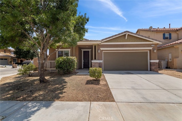 13159 Sunland St, Oak Hills, CA 92344 - view of front facade with a garage
