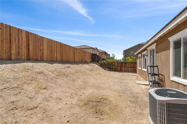 view of yard with central AC unit