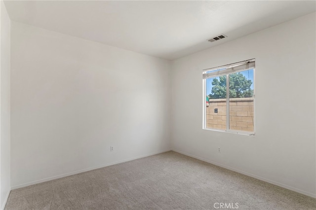 spare room featuring carpet