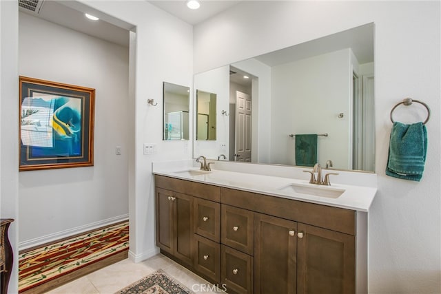 bathroom with vanity and tile patterned flooring