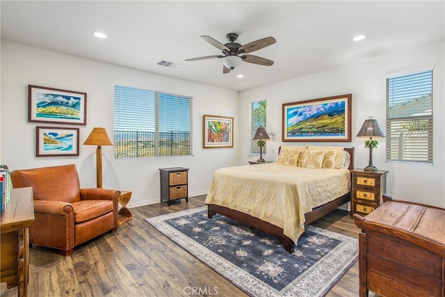 bedroom featuring ceiling fan and dark hardwood / wood-style flooring