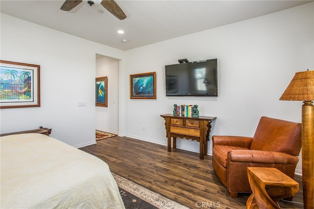 bedroom with dark hardwood / wood-style floors and ceiling fan