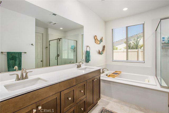 bathroom with vanity, independent shower and bath, and tile patterned flooring