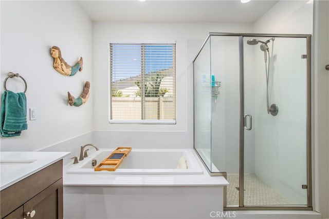 bathroom with vanity and separate shower and tub