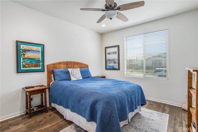 bedroom with ceiling fan and dark hardwood / wood-style floors