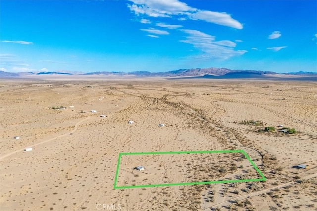 birds eye view of property featuring a mountain view