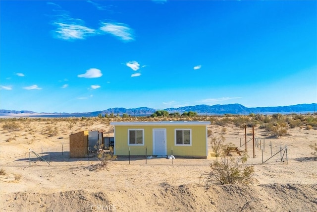 view of front of property with a mountain view