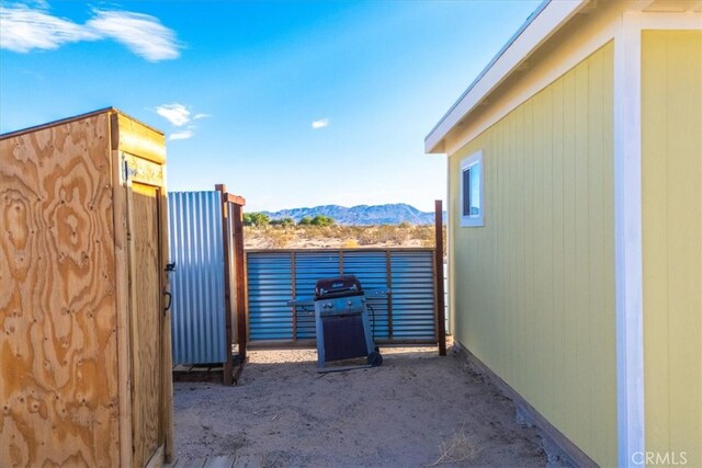 view of patio featuring a mountain view and a grill