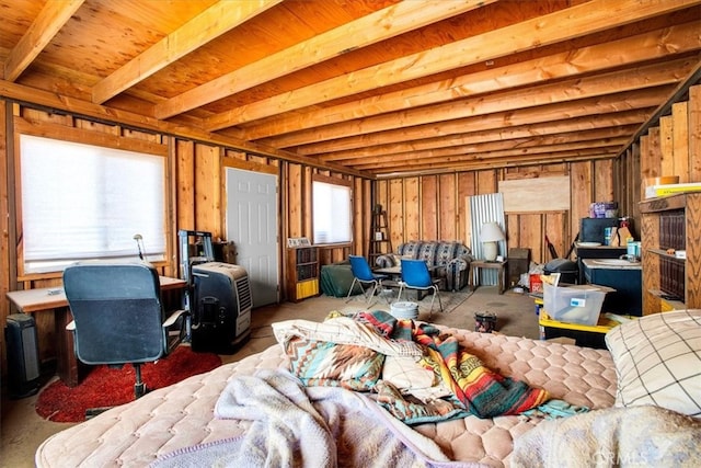 misc room featuring wood walls and beam ceiling