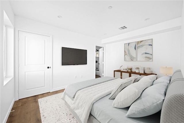 bedroom featuring dark hardwood / wood-style flooring