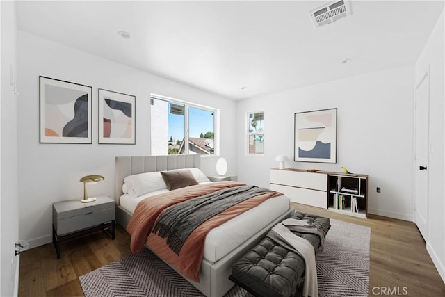 bedroom featuring wood-type flooring