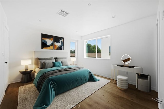 bedroom with hardwood / wood-style flooring