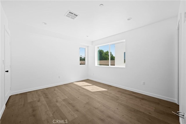 spare room featuring hardwood / wood-style floors