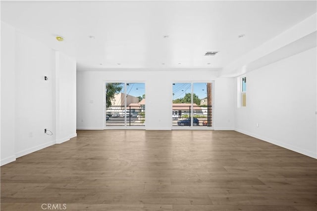 empty room featuring dark wood-type flooring