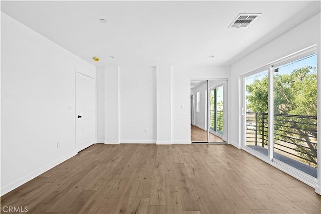 empty room featuring hardwood / wood-style flooring