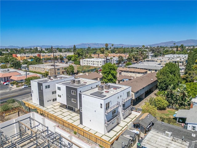 birds eye view of property featuring a mountain view