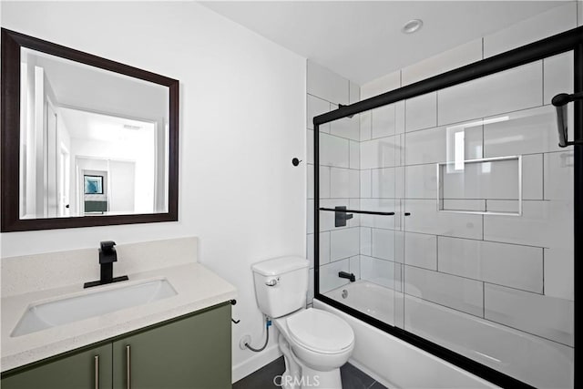 full bathroom with vanity, toilet, and combined bath / shower with glass door