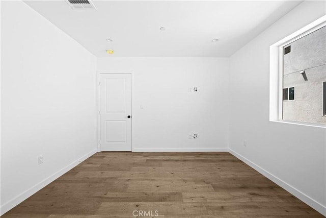 empty room featuring hardwood / wood-style floors