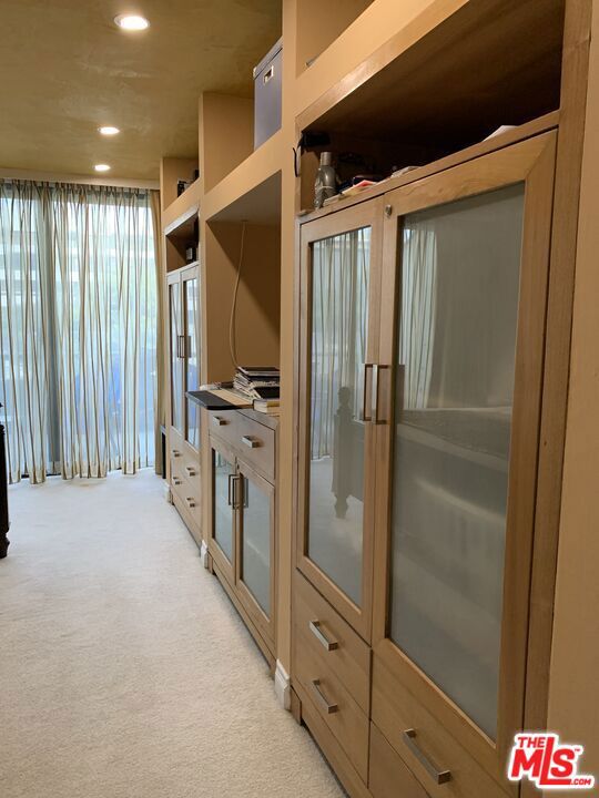 kitchen featuring light carpet