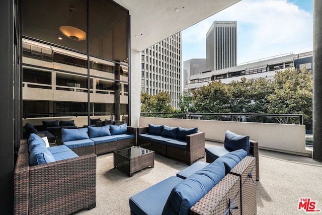 view of patio featuring a balcony and an outdoor hangout area