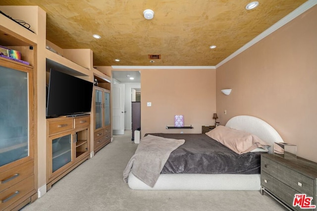 carpeted bedroom featuring ornamental molding