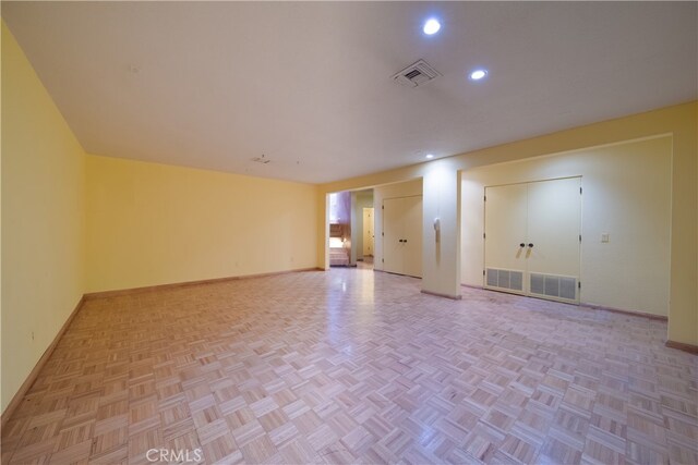 spare room with light parquet flooring