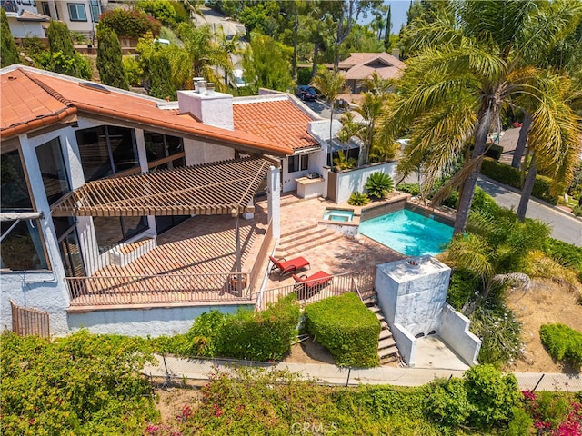 view of swimming pool featuring an in ground hot tub and a patio area