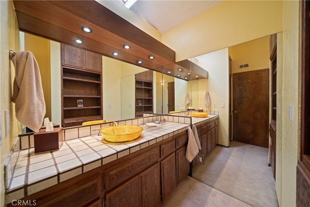 bathroom with vanity and built in features