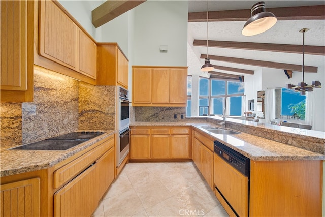 kitchen featuring hanging light fixtures, light stone counters, tasteful backsplash, black appliances, and sink