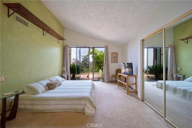 bedroom featuring a textured ceiling, access to outside, lofted ceiling, and light carpet