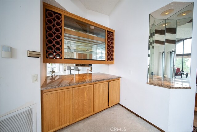 bar featuring light colored carpet