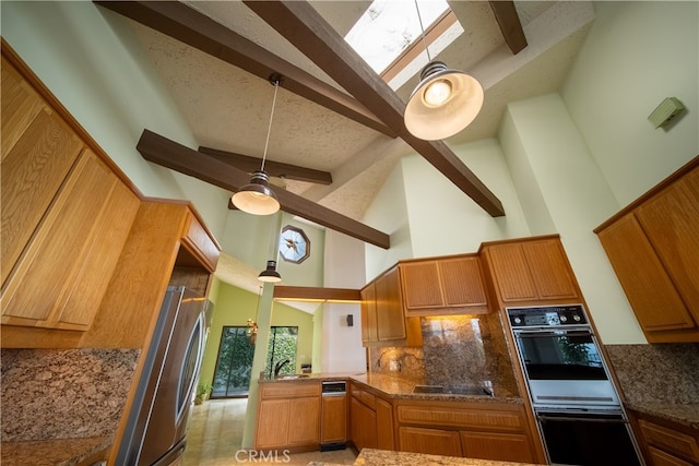 kitchen with high vaulted ceiling, kitchen peninsula, beamed ceiling, black appliances, and ceiling fan