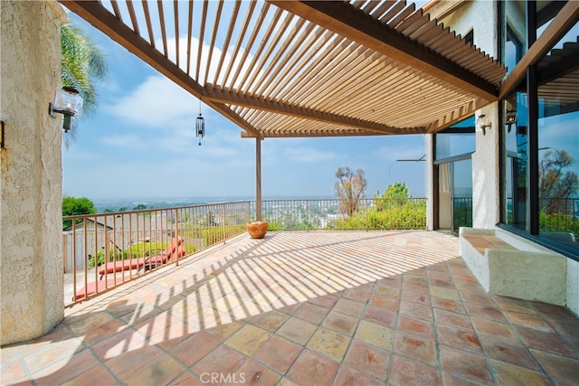 view of patio featuring a pergola and a water view