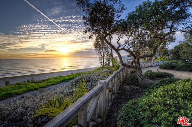 property view of water featuring a beach view