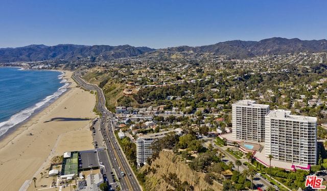 birds eye view of property with a beach view and a water and mountain view