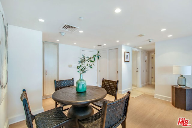 dining area featuring light wood-type flooring