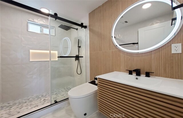 bathroom featuring vanity, toilet, walk in shower, and wooden walls