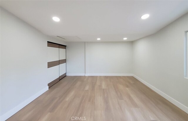 unfurnished room with light hardwood / wood-style floors