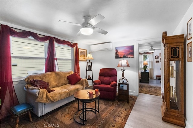 living room with a wealth of natural light, ceiling fan, and hardwood / wood-style flooring