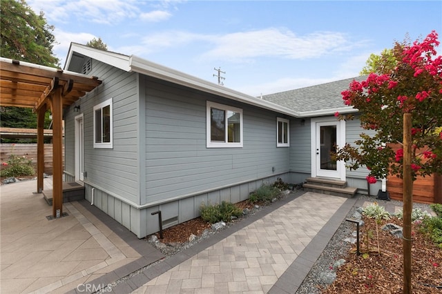 view of property exterior featuring a patio area