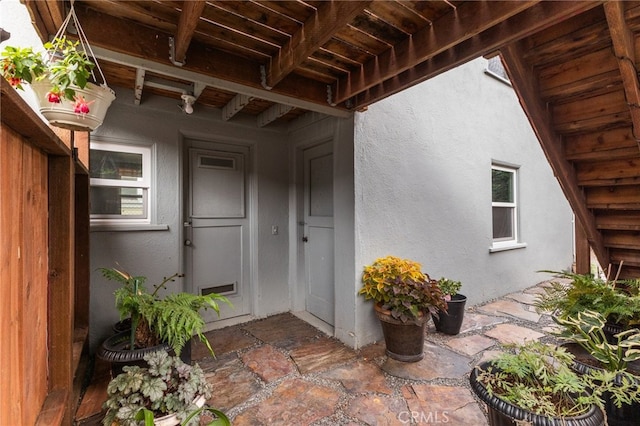 doorway to property with a patio