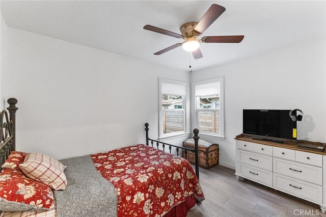 bedroom featuring ceiling fan and dark wood-type flooring