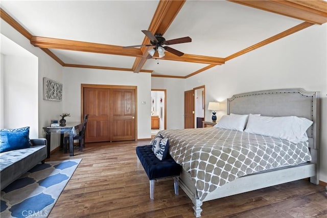 bedroom with hardwood / wood-style floors, ceiling fan, ornamental molding, and beamed ceiling