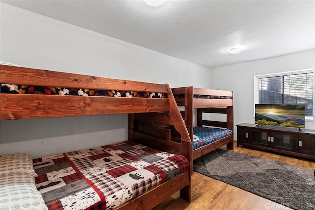 bedroom with wood-type flooring