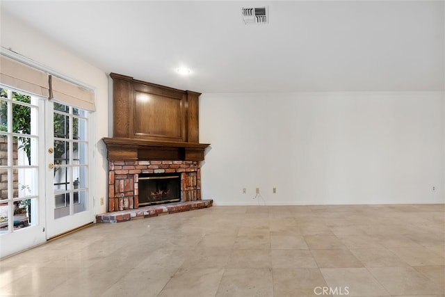 living room featuring a fireplace and ornamental molding