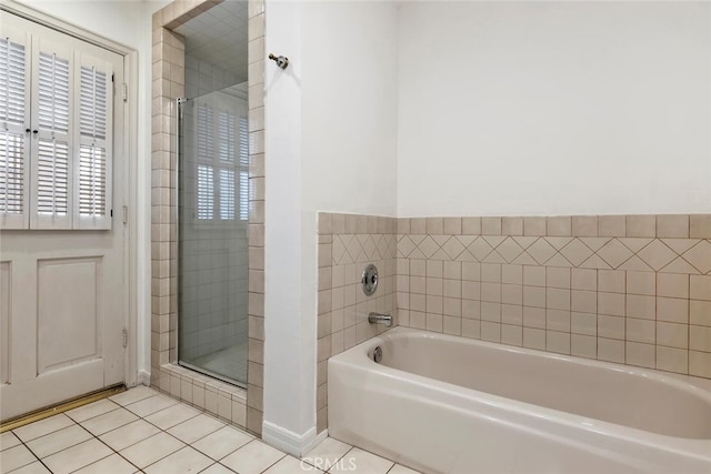 bathroom featuring tile patterned flooring and independent shower and bath