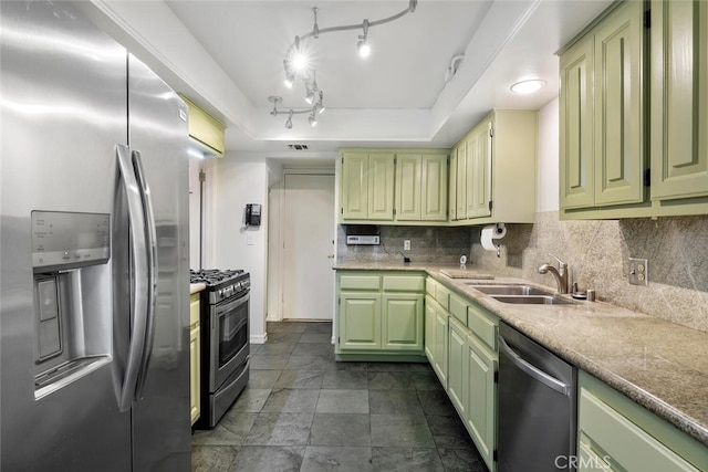 kitchen featuring green cabinets, sink, and appliances with stainless steel finishes