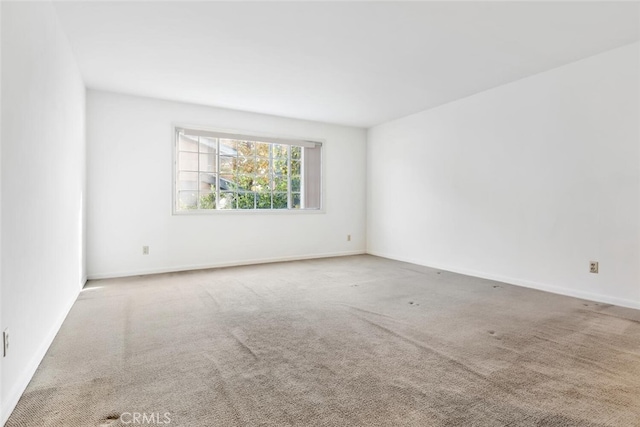 spare room featuring carpet flooring