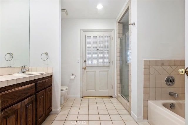 bathroom featuring tile patterned floors, vanity, and toilet