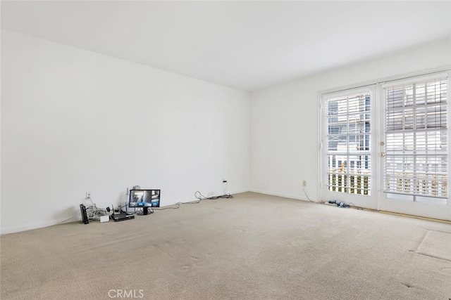 unfurnished room featuring carpet flooring